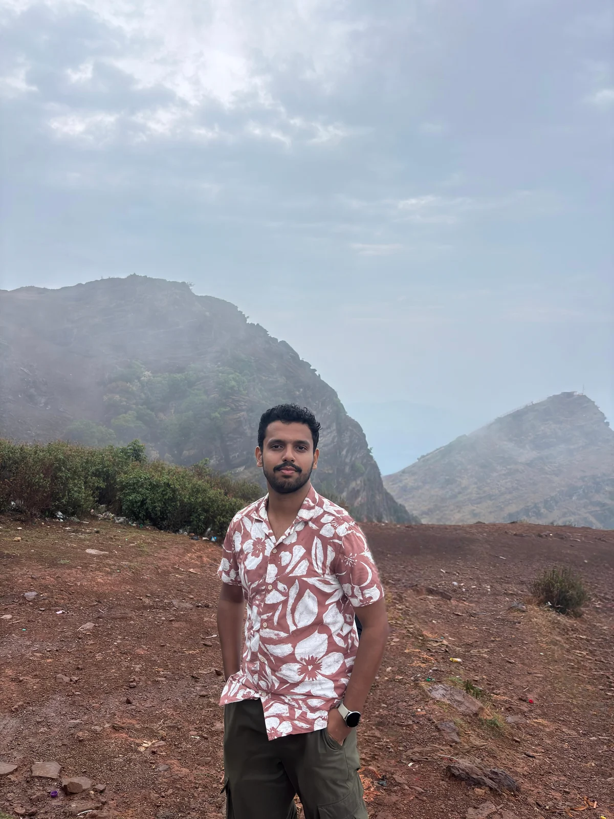Noel Biju outdoors in the mountains